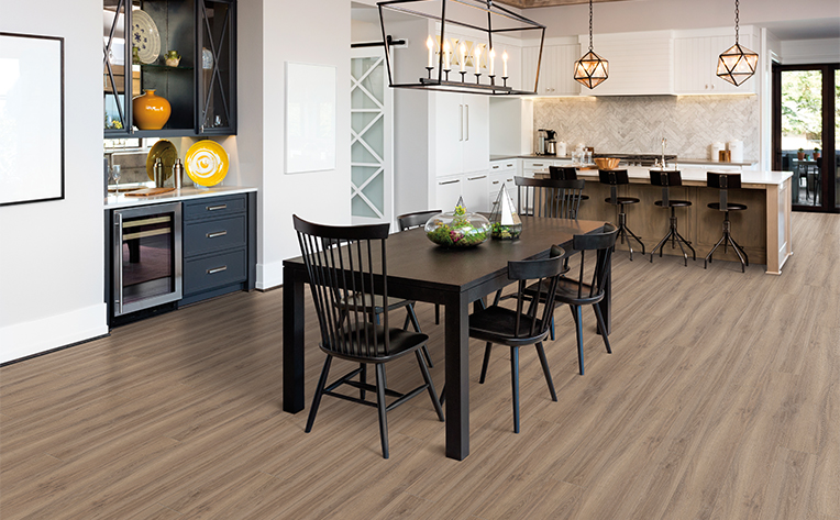 tile flooring in open concept kitchen with large table